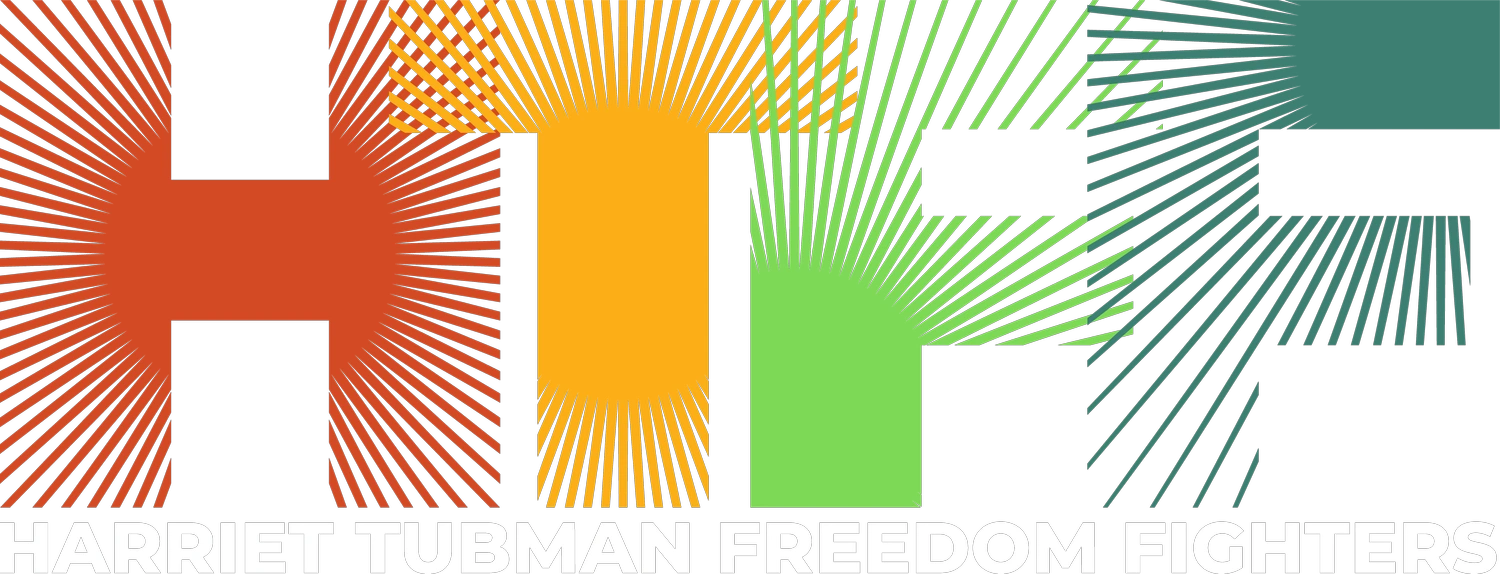 A green and yellow logo with the words " human freedom ".