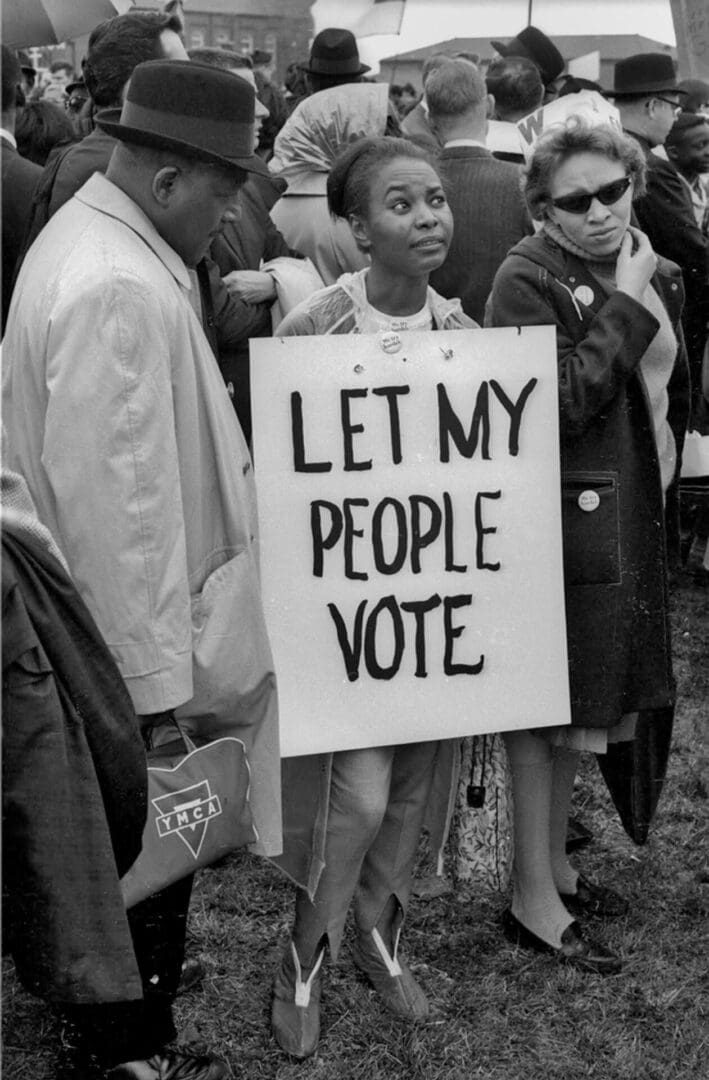 A black and white photo of people protesting.